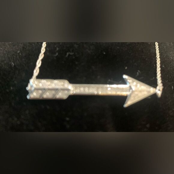 Sterling silver with .15 ctw diamonds. It’s a cute little cupids arrow. 16” - Picture 3 of 4